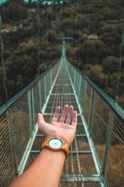 Free photo hand on a bridge