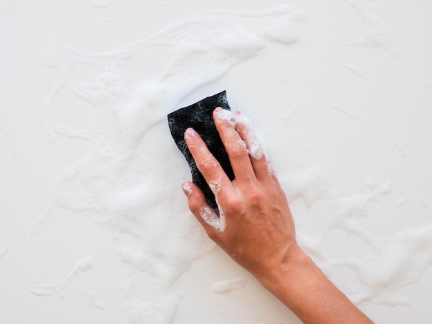 Hand cleaning surface with sponge and foam