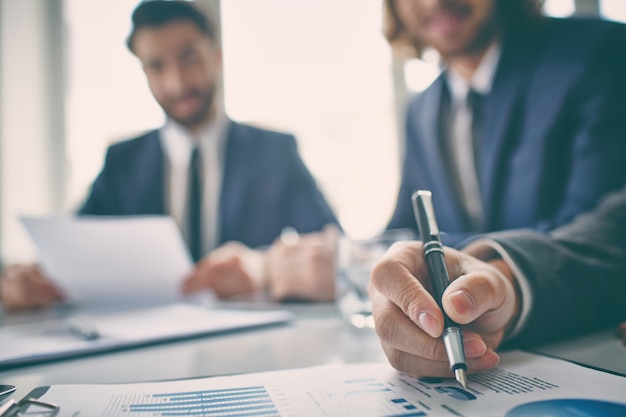 Free Photo hand close-up of an executive reviewing a chart