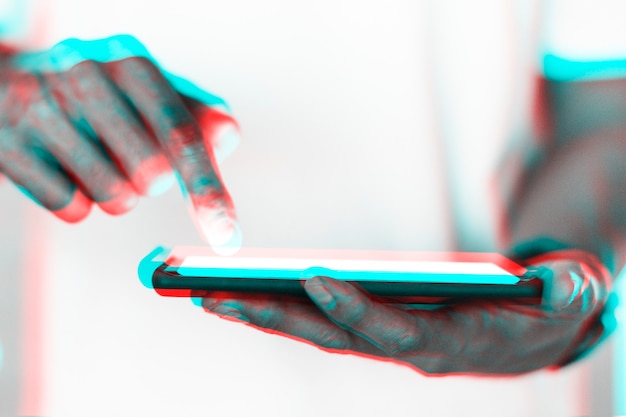 Free photo hand and futuristic smartphone in double color exposure effect