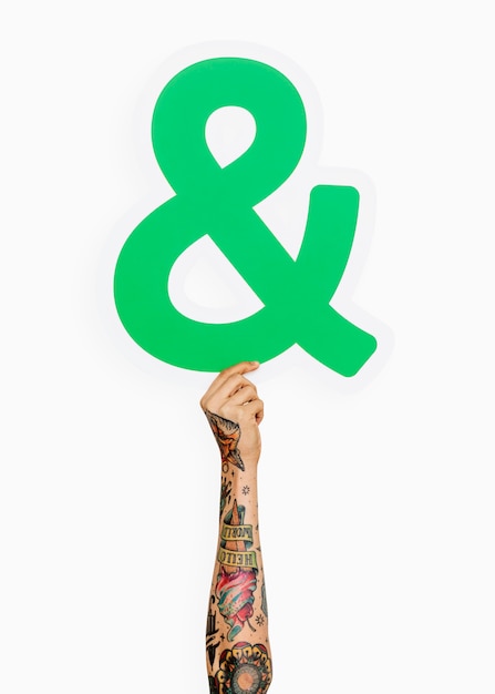 Free Photo hand holding ampersand symbol