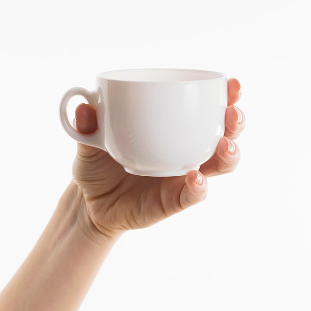 Free Photo hand holding cup