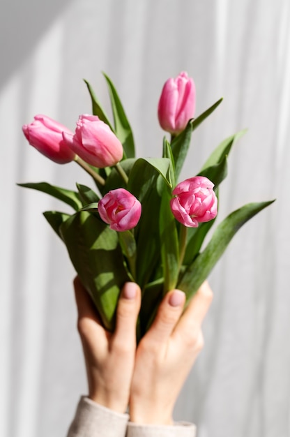 Hand holding elegant flower