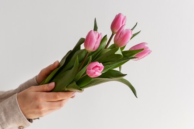 Hand holding elegant flower