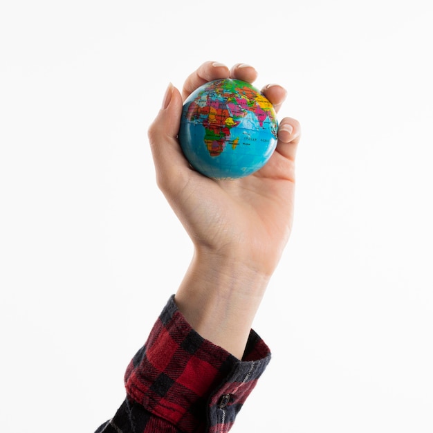 Hand holding globe