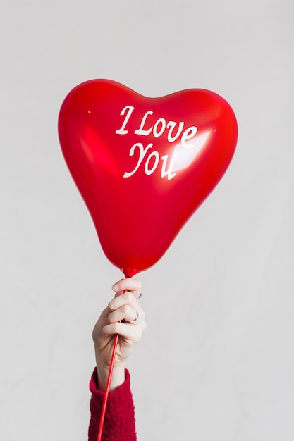 Free Photo hand holding i love you balloon