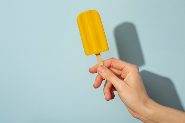 Hand holding ice cream pop stickle