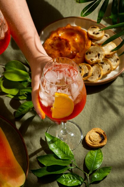 Hand holding italian cocktail still life