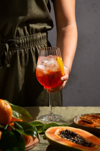 Hand holding italian cocktail still life