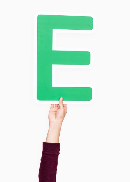 Free photo hand holding the letter e