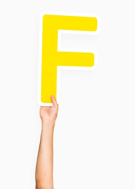 Free photo hand holding the letter f