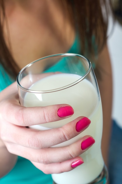 Free Photo "hand holding milk."