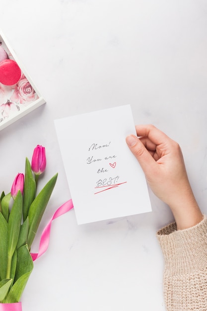 Hand holding mother's day card