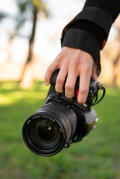 Hand holding photo camera