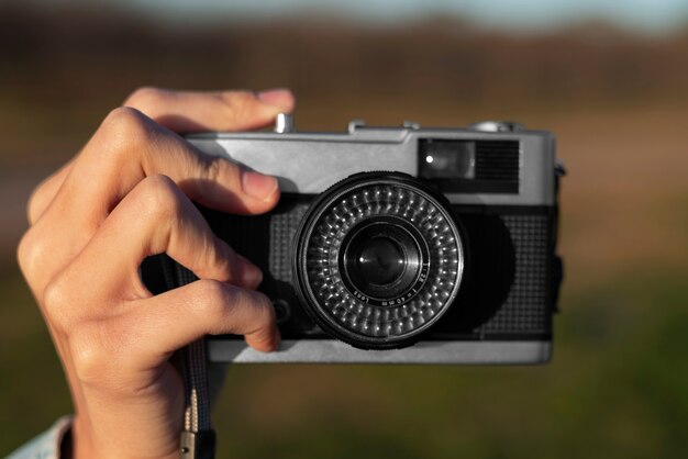 Free Photo hand holding photo camera