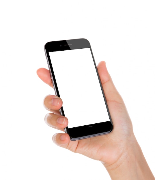 Hand holding a smartphone with blank screen and white background