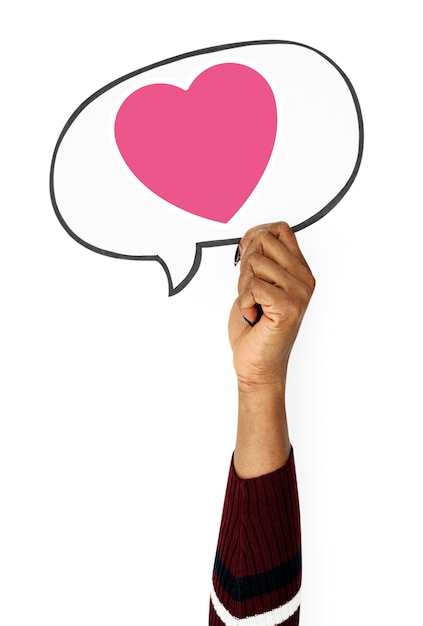 Free photo hand holding speech bubble with heart icon