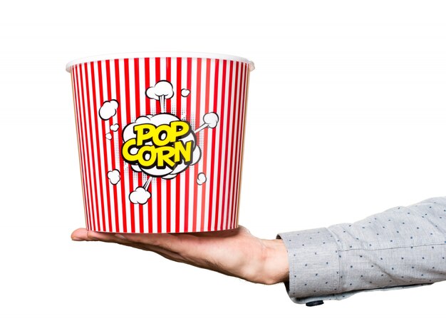 Free Photo hand of man holding popcorn box