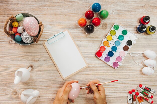 Hand painting egg in workshop