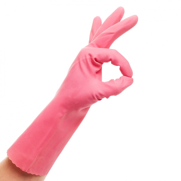 Free Photo hand in a pink domestic glove shows ok