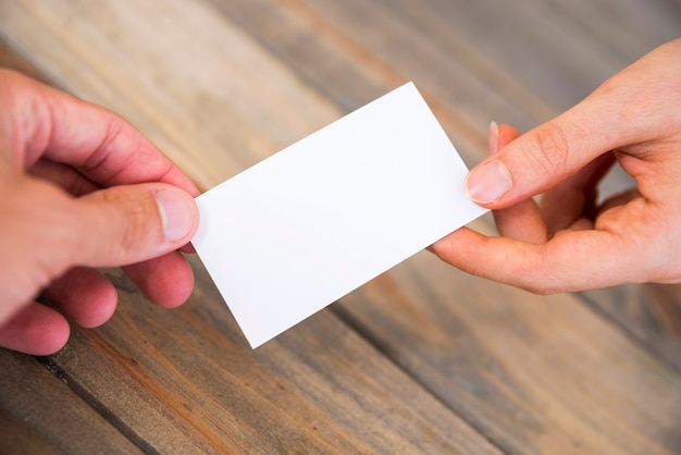 Free Photo hand showing a blank business card