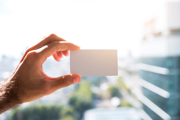 Hand showing a blank business card