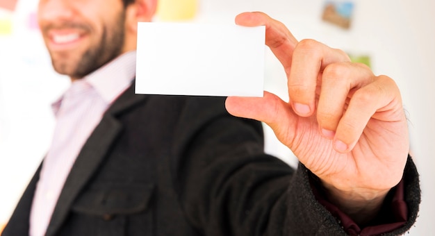 Hand showing a blank business card