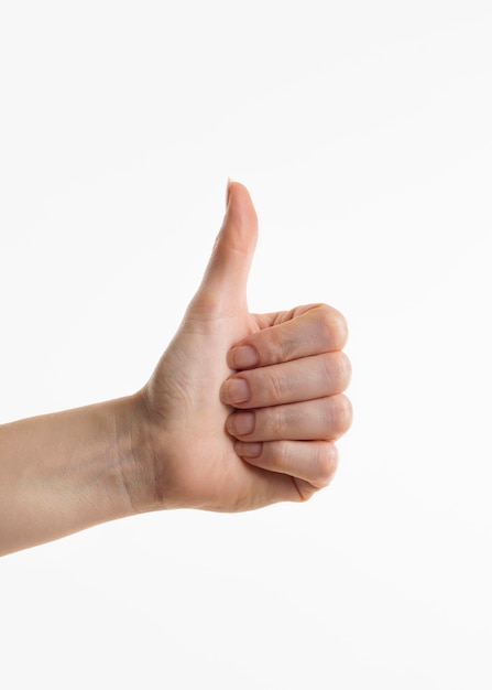 Hand showing thumbs up