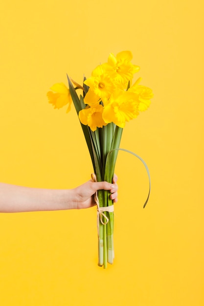 Hand with flowers bouquet