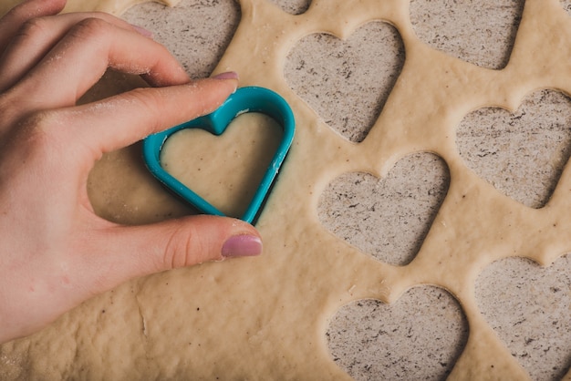 Free Photo hand with mold for dough