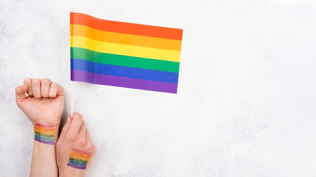 Hand with rainbow flag paint