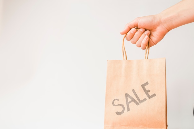 Free photo hand with shopping bag