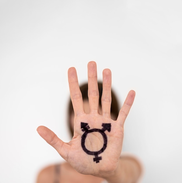 Free photo hand with transgender sign drawn