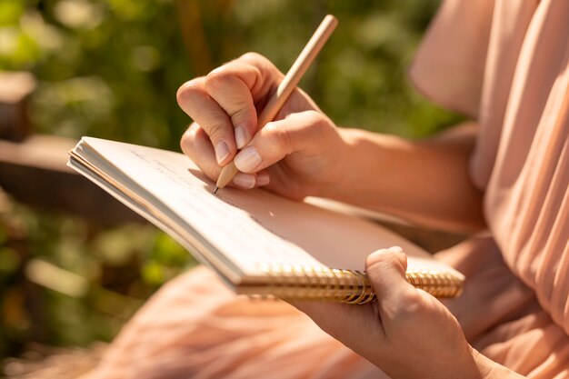 Hand writing on notebook close up