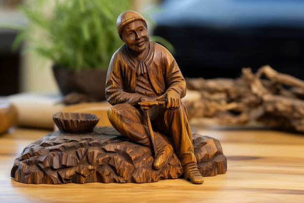 Free Photo handcrafted wooden decorative peasant  sculpture