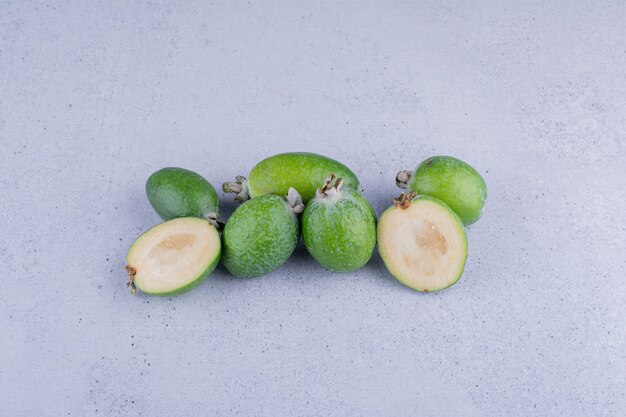 Handful of fresh feijoas on marble background. High quality photo