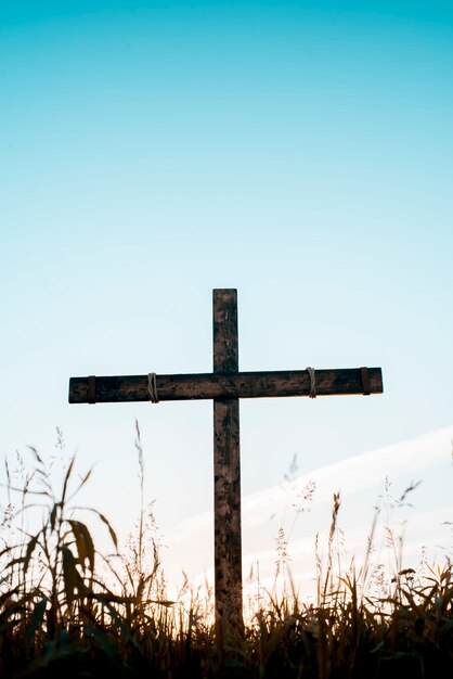 handmade wooden cross with a blue sky