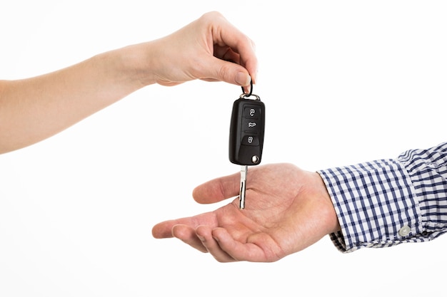 Hands exchanging car keys