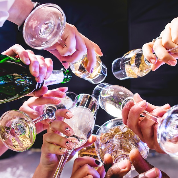 Hands of friends with wineglasses