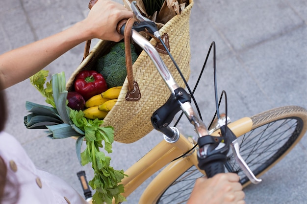 Hands holding bicycle handlebars close up