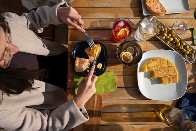 Free photo hands holding cutlery top view