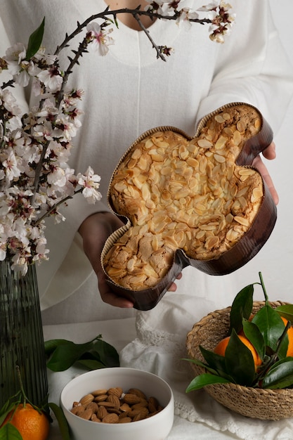 Hands holding delicious colomba high angle