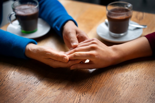 Hands holding each other for support