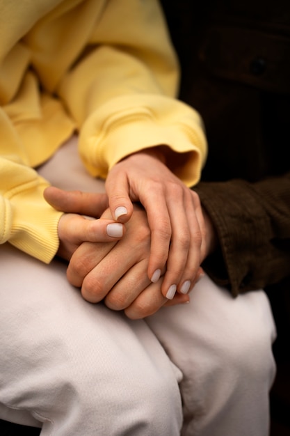 Hands holding each other for support