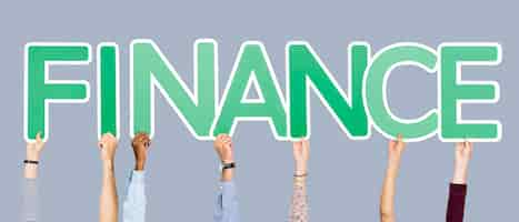 Free photo hands holding up green letters forming the word finance