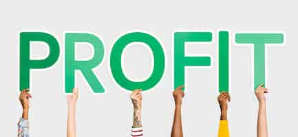 Free photo hands holding up green letters forming the word profit