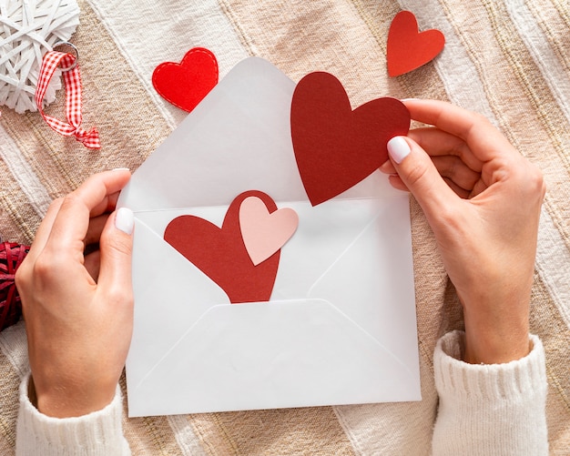 Hands holding valentine envelope