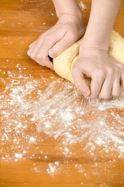 Free photo hands kneading dough