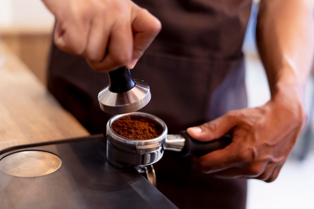 Hands making coffee close up