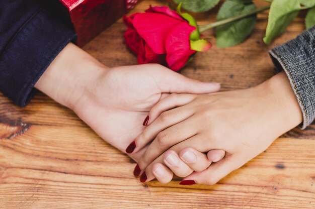 Hands of a man and woman caught